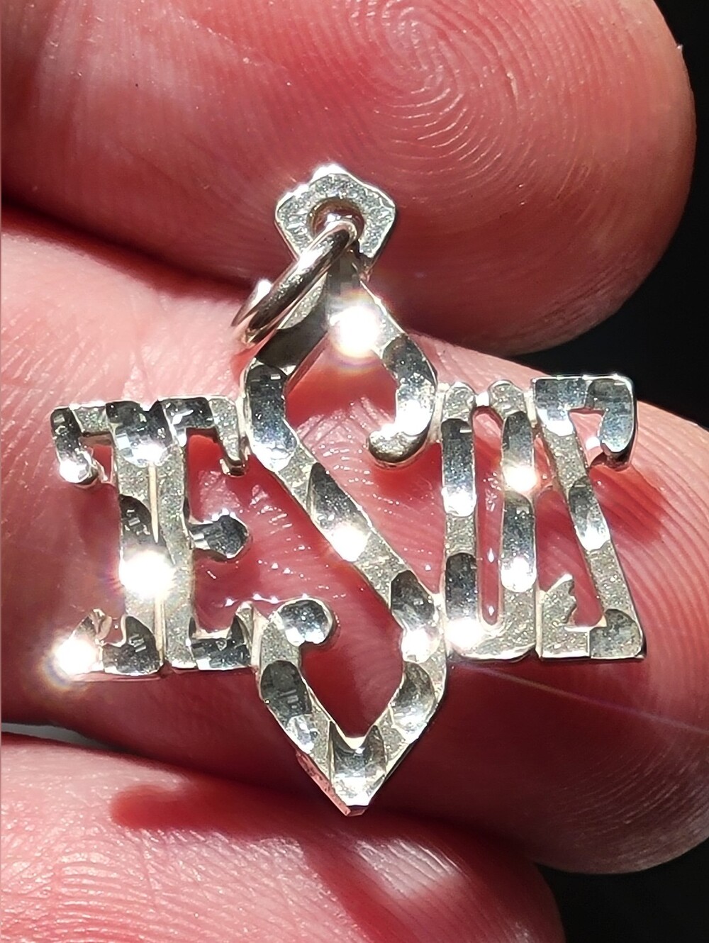 Jesus Cross Charm Silver Jesus cross charm with the word 'JESUS'
